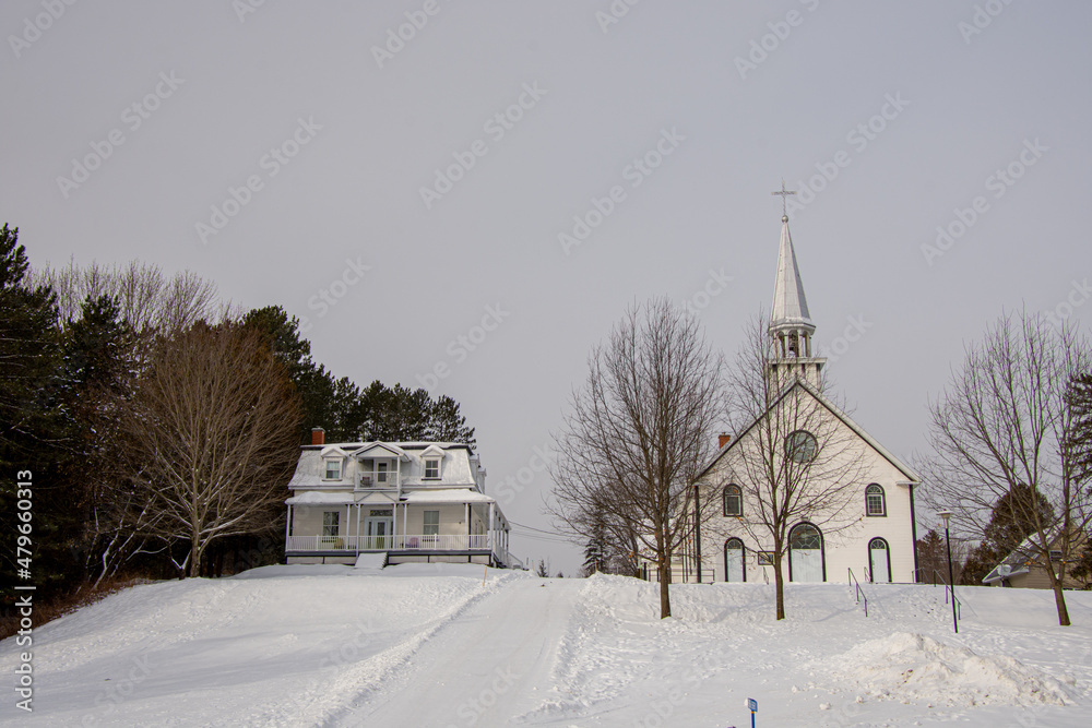Old church in the Canadian winter in the province of Quebec