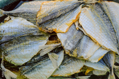 Yellow-striped selar. Dried salted fish. Salty snack. photo