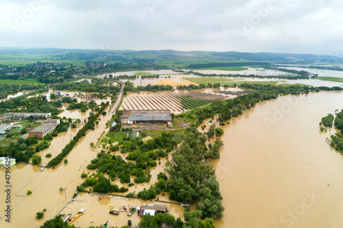 Aerial view of Dnister river with dirty water and flooded houses in Halych town, western Ukraine. photo
