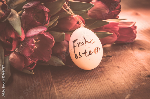 Fototapeta Dekoration with tulips easter egg and text Frohe Ostern