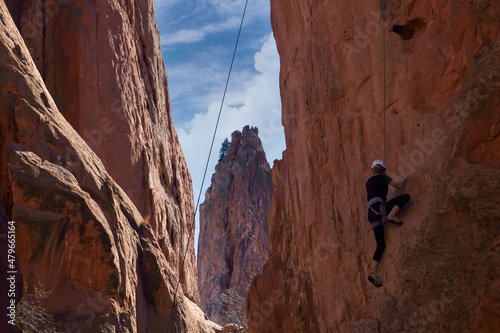 Young Woman Rock Climbing