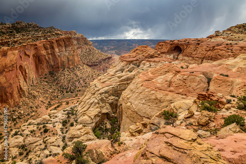 Cassidy Arch on a stormy day. Named for Butch Cassidy, this arch sits 400 feet above the Scenic Drive with sweeping views. photo