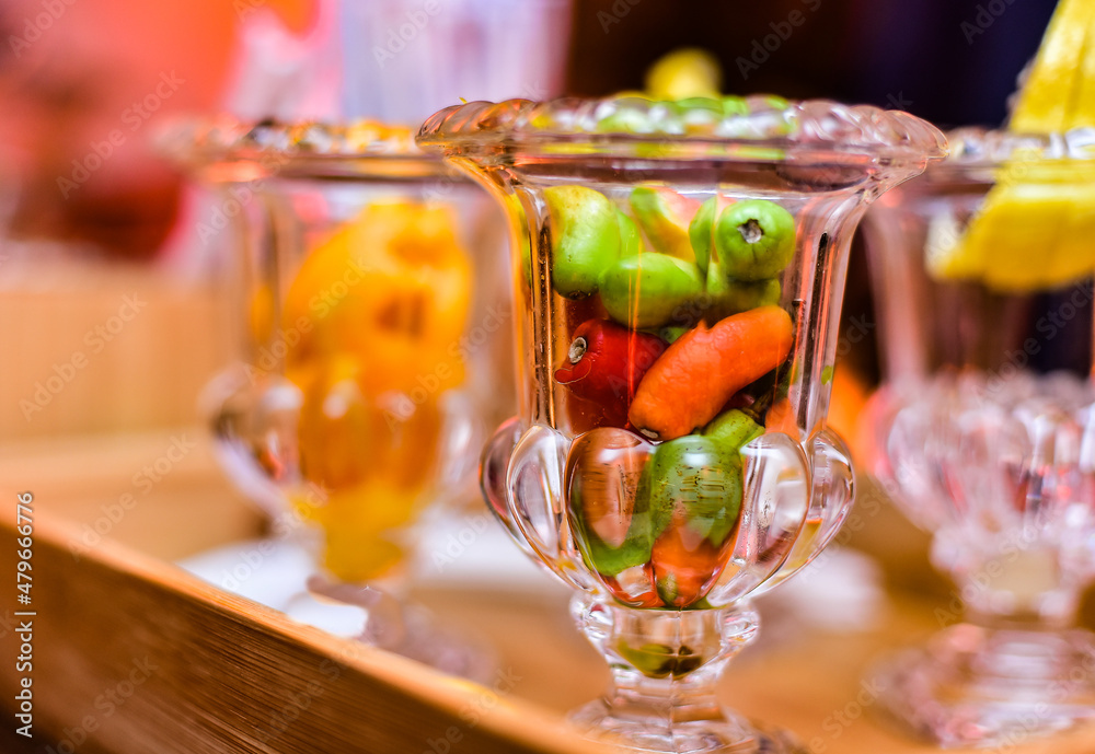 glass bowl with colored peppers
