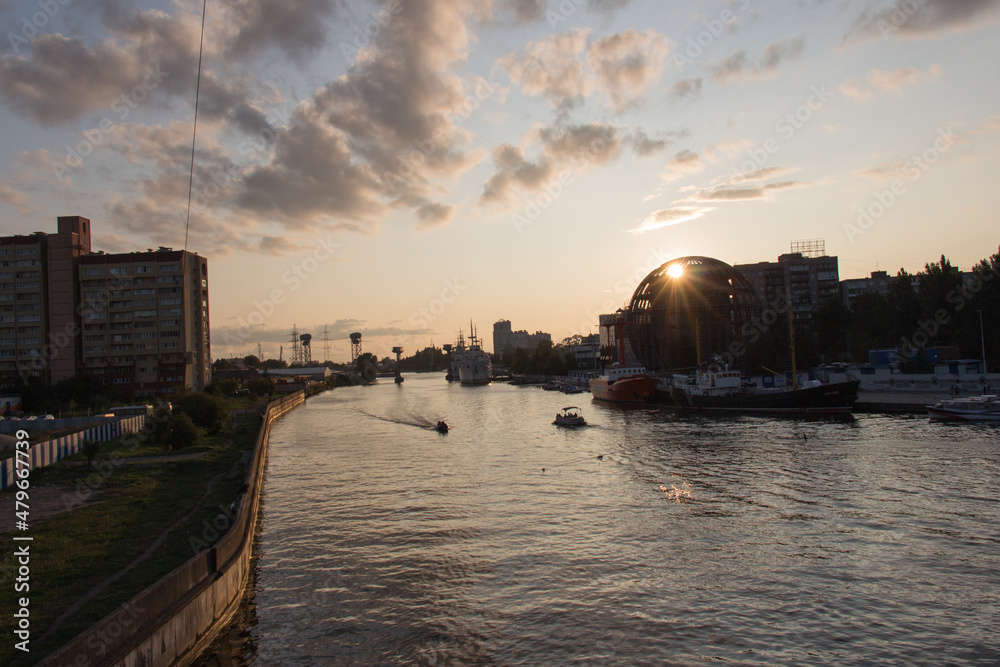Naklejka premium Ships at pier of Pregolya River near World Ocean Museum at sunset light, Kaliningrad, Russia