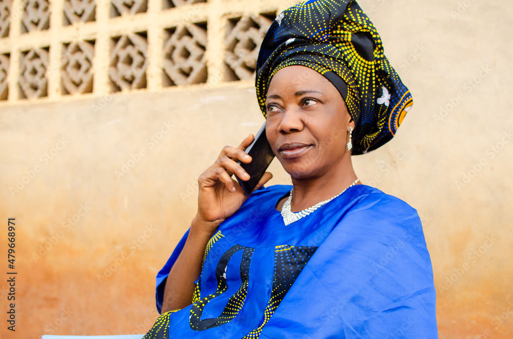 aged woman seating outdoor making calls aged woman seating outdoor making calls