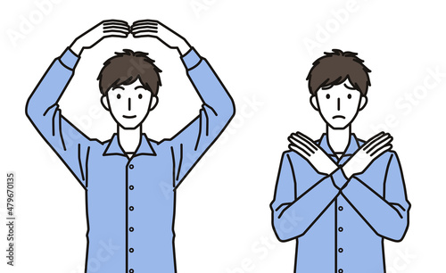 まるばつのジェスチャーをする男性