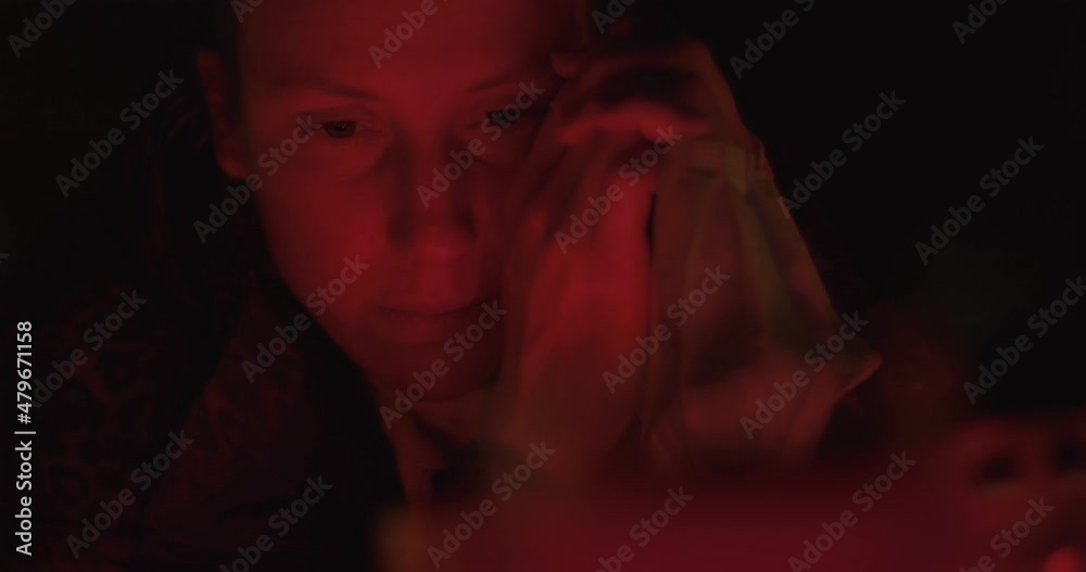 Woman mask in hands cry mourn cemetery or graveyard candles at night Woman mask in hands cry mourn cemetery or graveyard candles at night