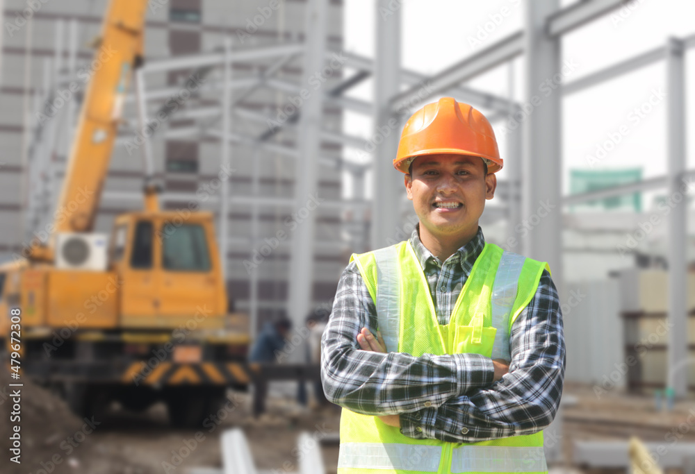 portrait of foreman construction worker on location new building site with crane in the background portrait of foreman construction worker on location new building site with crane in the background