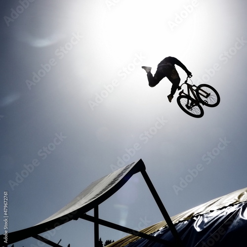 Принти на полотні dirtbike bmx rider jumps against sun