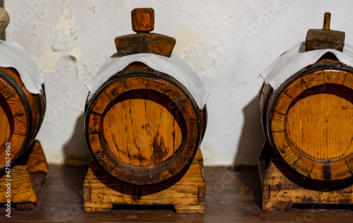 Traditional production and aging in wooden barrels of Italian Balsamic grapes vinegar dressing in Modena, Italy