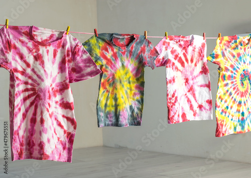 Obraz na płótnie The drying process of T-shirts painted in tie dye style.
