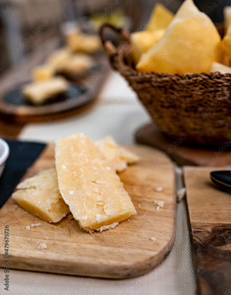 Tasting of different matured and old parmesan Parmigiano-Reggiano hard cheese in Parma, Emilia Romagna, Italy Tasting of different matured and old parmesan Parmigiano-Reggiano hard cheese in Parma, Emilia Romagna, Italy