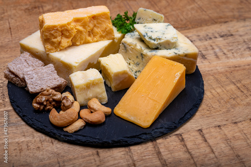 British cheeses collection, blue Stilton, Scottish coloured and English matured cheddar cheeses