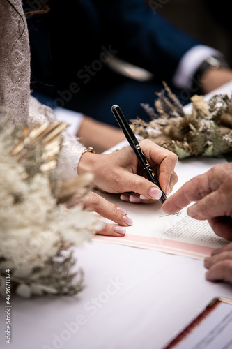 Bride and Groom signing after the exchange of vows - French wedding along the French Riviera - Summer 2021 photo