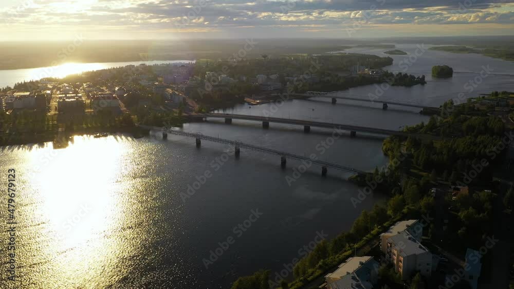 Aerial view of bridges in downtown Tornio, golden hour in Finland - tracking, drone shot Aerial view of bridges in downtown Tornio, golden hour in Finland - tracking, drone shot