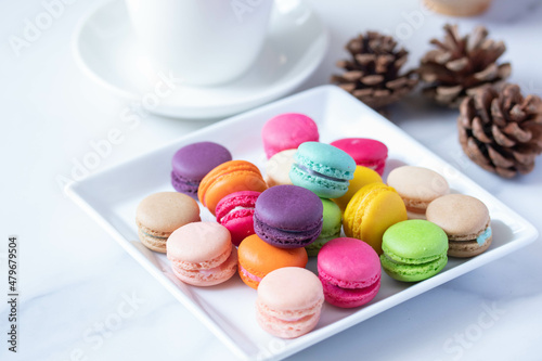 colorful macarons in white plate