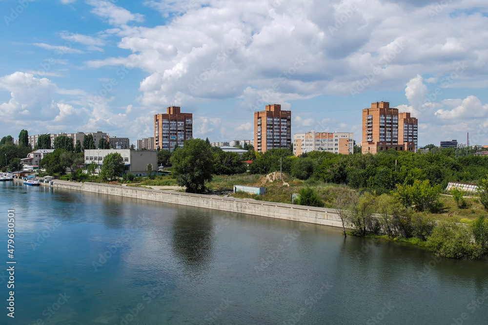 View of the city of Ust-Kamenogorsk (kazakhstan). Old residential area. Soviet built multistory apartment buildings. Irtysh river. Green trees and blue sky