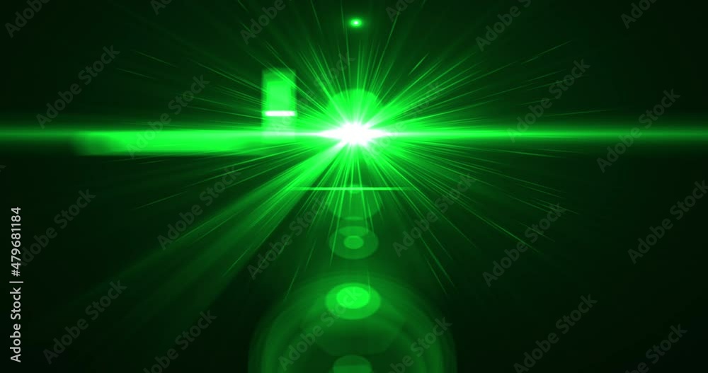 Motion of green star lens flare bokeh blur ray light blazing movement abstract on black background. Motion of green star lens flare bokeh blur ray light blazing movement abstract on black background.