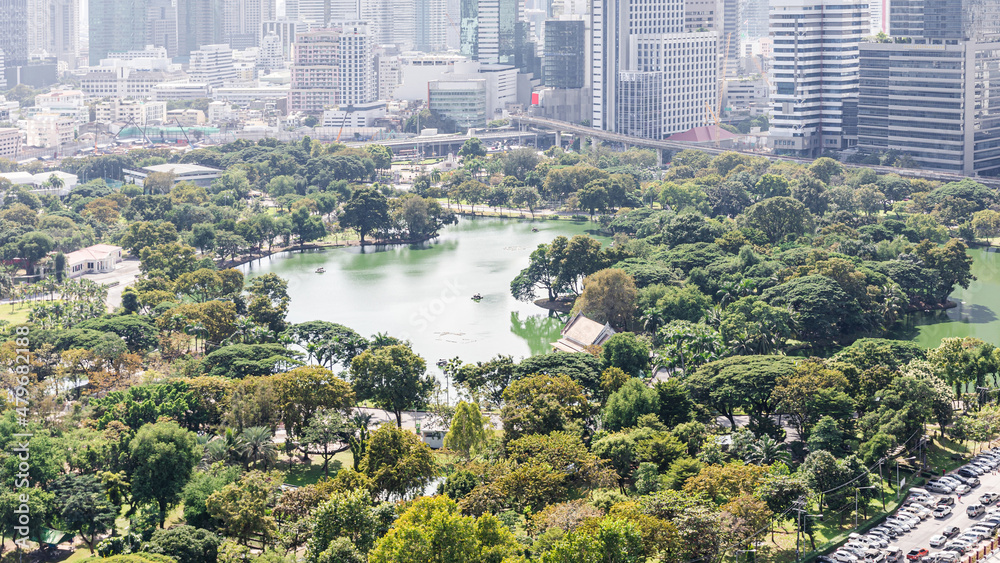 Naklejka premium Wonderful cityscape at Lumphini Park, Park is a park in Bangkok, Thailand.