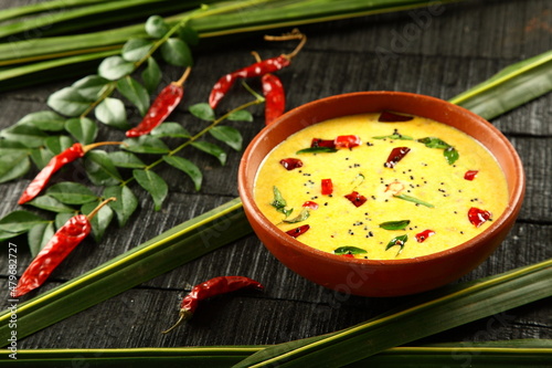 Moru kachiyathu, Kachu moru, spiced buttermilk curry. Kerala recipes background. photo