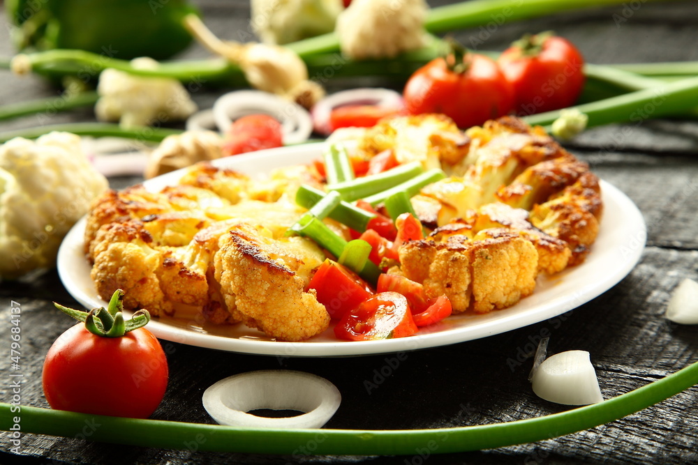 Delicious grilled cauliflower and vegetables, cooked with exotic spices and herbs.