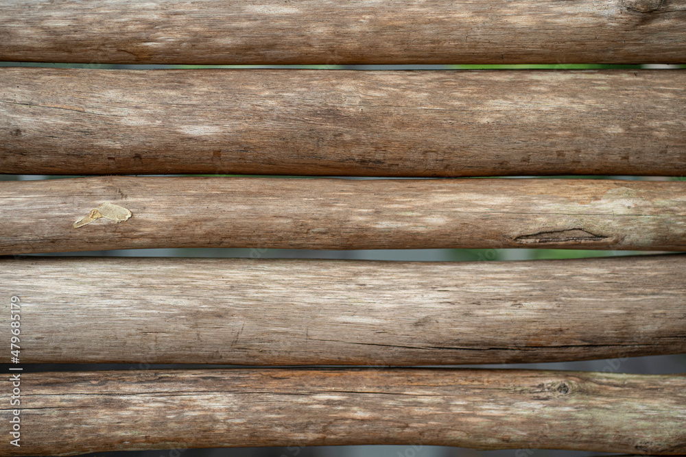 Straight woods arranged as a wall. Selective focus points Straight woods arranged as a wall. Selective focus points