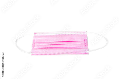 Pink mask isolated on white background, mask for protection against respiratory tract germs.