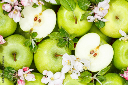 Fototapeta Naklejka Na Ścianę i Meble -  Apples fruits green apple fruit background with leaves and blossoms