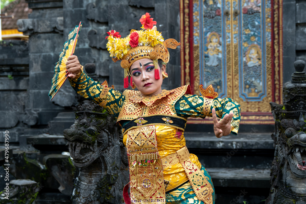 Balinese dancer woman in gold costume, Temple Bali Indonesia