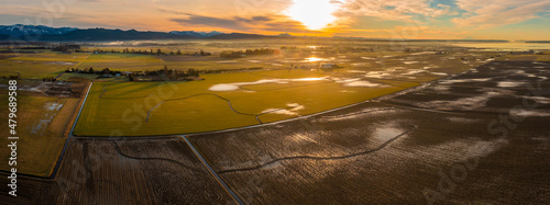 Aerial Panorama of a Beautiful Skagit Valley Sunrise. This agricultural hub of western Washington state has over 90 different crops that are grown in the County. This drone view is after a rainfall.