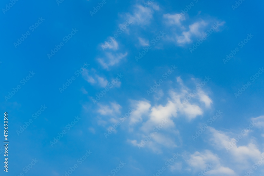 Bright blue sky with white fluffy clouds Bright blue sky with white fluffy clouds