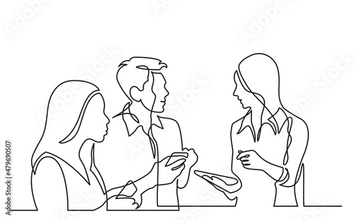 Canvas Print three diverse young professionals holding smartphones discussing work as team co