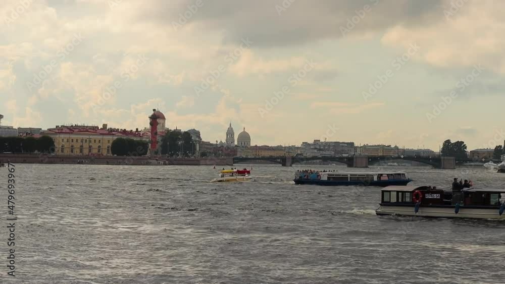 Tourist Boats Sailing Across The Neva River In Russia With Saint Petersburg City In Background. wide Tourist Boats Sailing Across The Neva River In Russia With Saint Petersburg City In Background. wide
