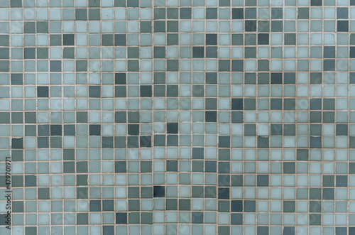 Blue mosaic tiles for bathroom or swimming pool. Ceramic square decorative tile. Abstract texture background.