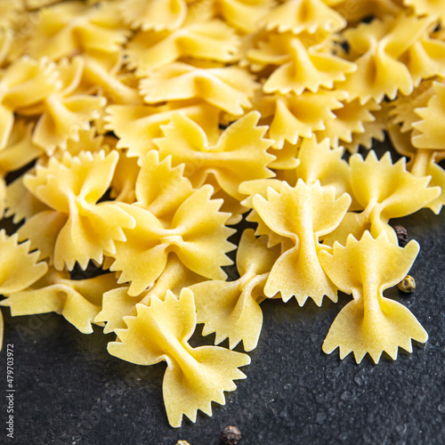 farfalle raw pasta cooking ingredient italian meal food snack on the table copy space food background photo