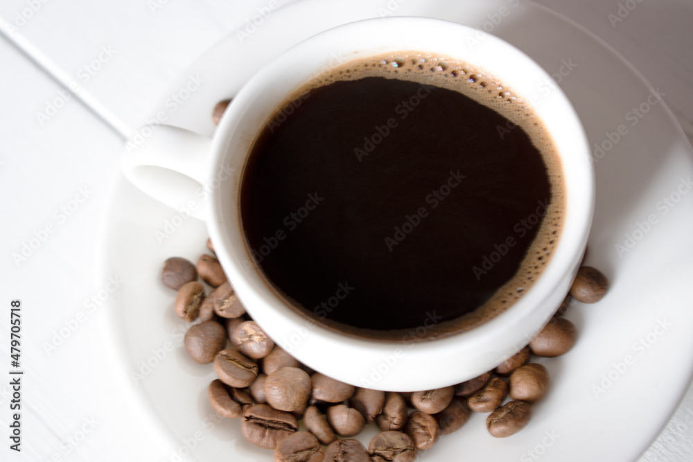 cup of black coffee with beans
