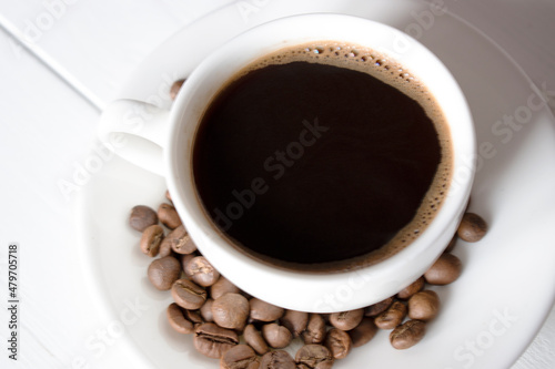 cup of black coffee with beans