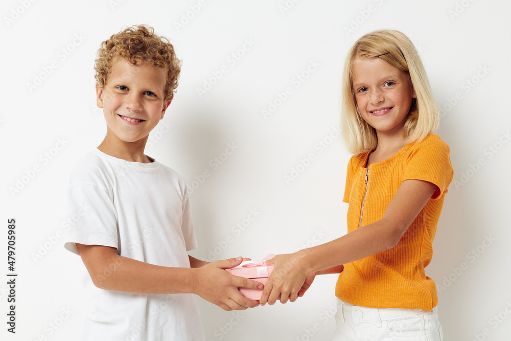 picture of positive boy and girl fun birthday gift surprise isolated background unaltered picture of positive boy and girl fun birthday gift surprise isolated background unaltered
