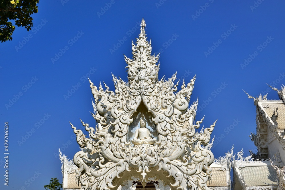 Wat Rong Khun OR White temple with blue sky background. ChiangRai  province, Thailand.