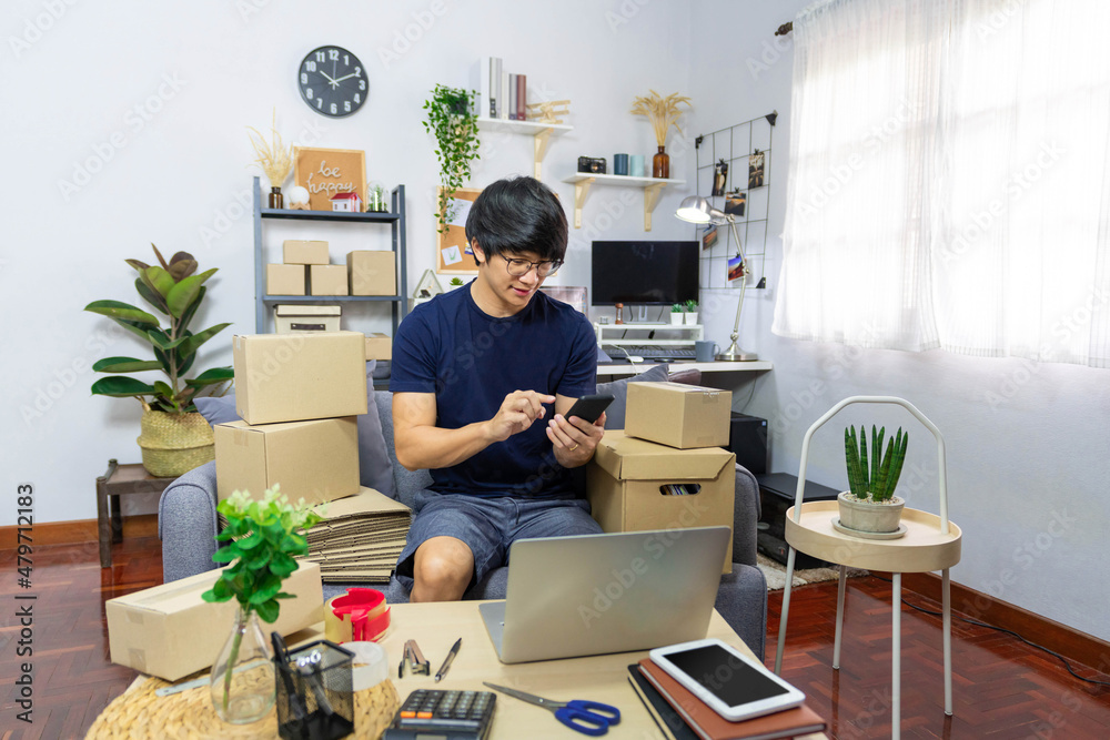 E-commerce concept a male online merchant using the electronic devices to simplify the complicated process E-commerce concept a male online merchant using the electronic devices to simplify the complicated process