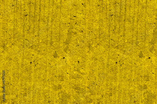 Yellow color rough concrete wall surface for texture background