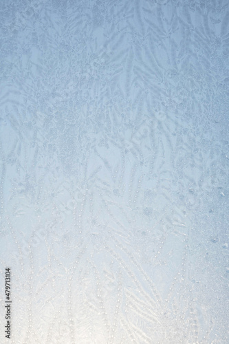 Abstract frost pattern. Frozen noisy window on the cold winter. Texture of ice on window.