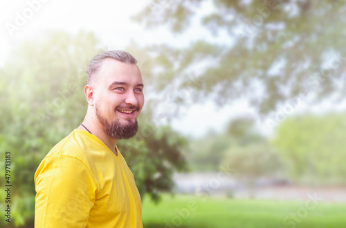 Portrait of happy man with beard outdoor