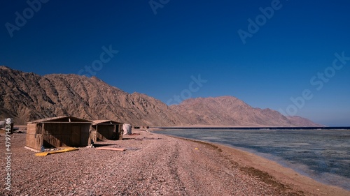 Beautiful red sea view with mountains and cloudy sky at dawn