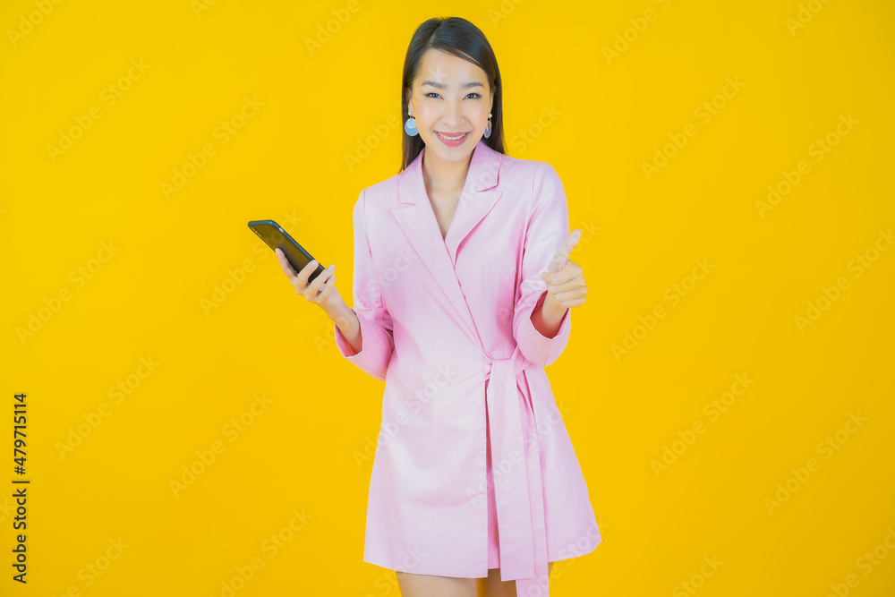 Portrait beautiful young asian woman smile with smart mobile phone