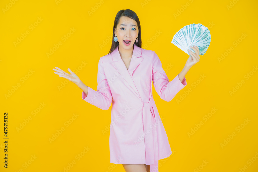 Portrait beautiful young asian woman smile with a lot of cash and money Portrait beautiful young asian woman smile with a lot of cash and money