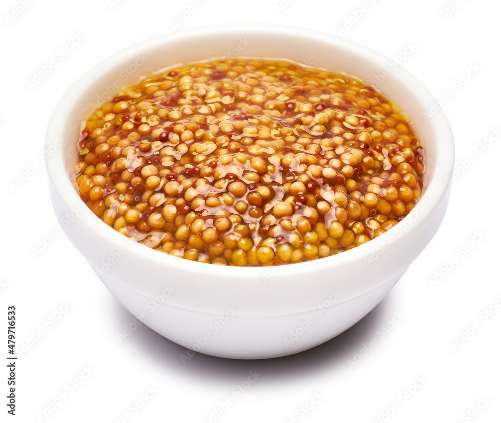 Classic Dijon mustard sauce in ceramic bowl isolated on white background Classic Dijon mustard sauce in ceramic bowl isolated on white background