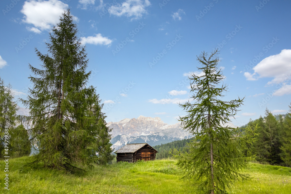 Small wooden hut in a mountain landscape in the Dolomite Alps