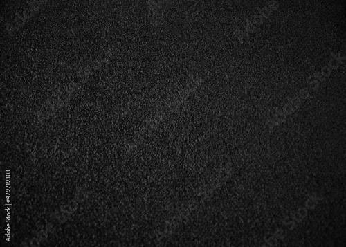 Black indoor office carpet texture. High resolution seamless monochrome wool fabric background. Interior material background top view. Short pile carpet. Blank generic microfiber textile texture.