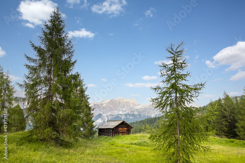 Small wooden hut in a mountain landscape in the Dolomite Alps